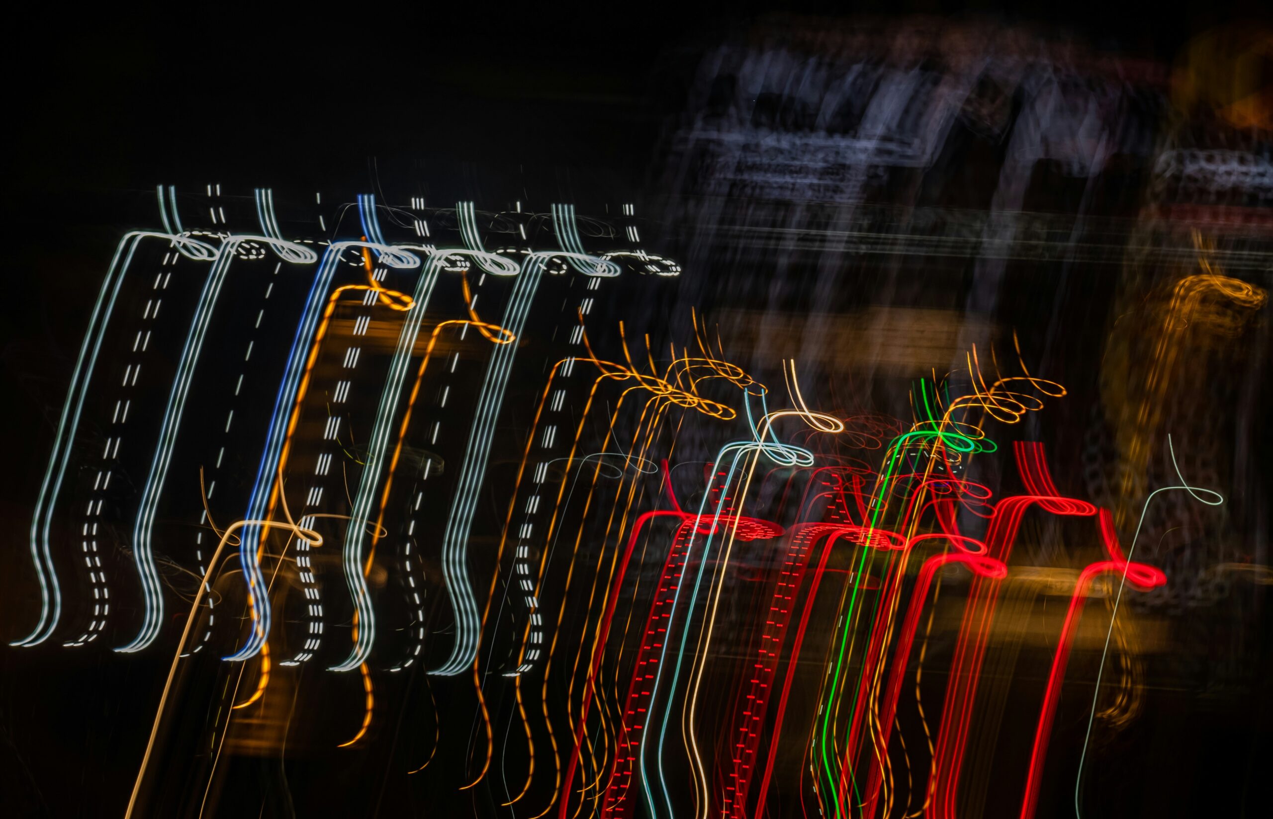 A cluttered suitcase filled with tangled cables and messy clothes.