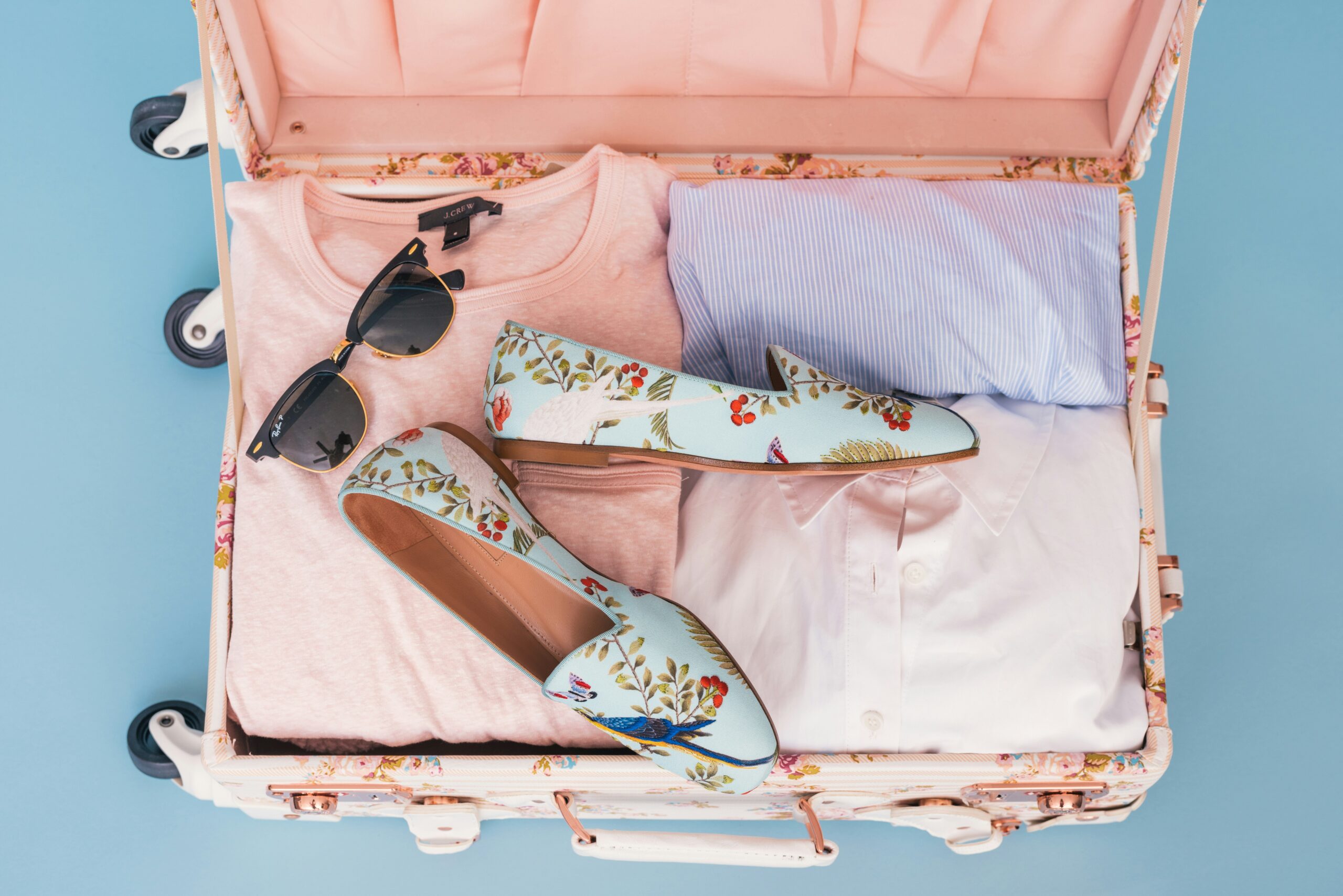 Side-by-side comparison of three modern suitcases designed with built-in organizers and stylish finishes.