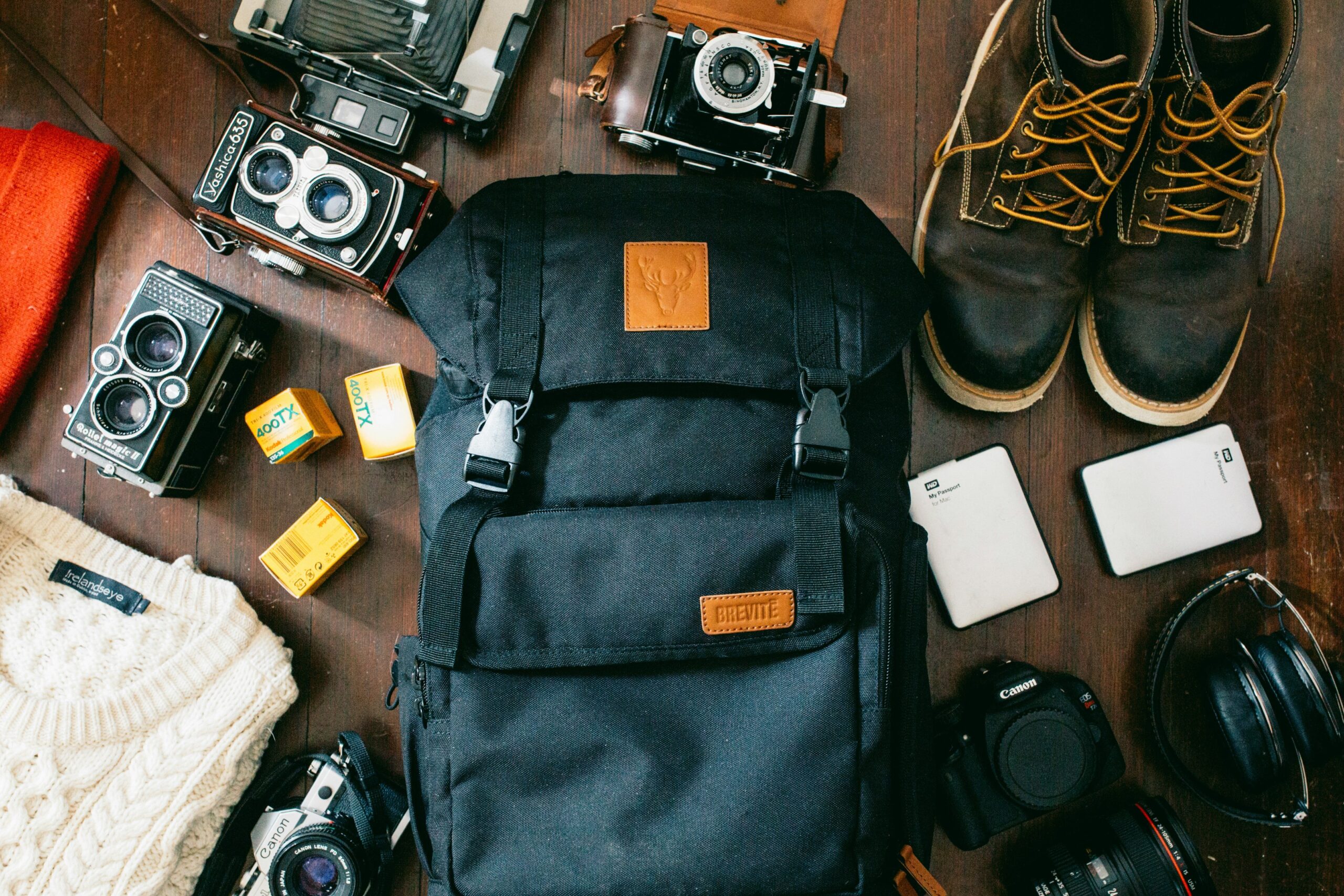 Photo of an influencer posing with their Peak Design Everyday Backpack against a scenic backdrop.