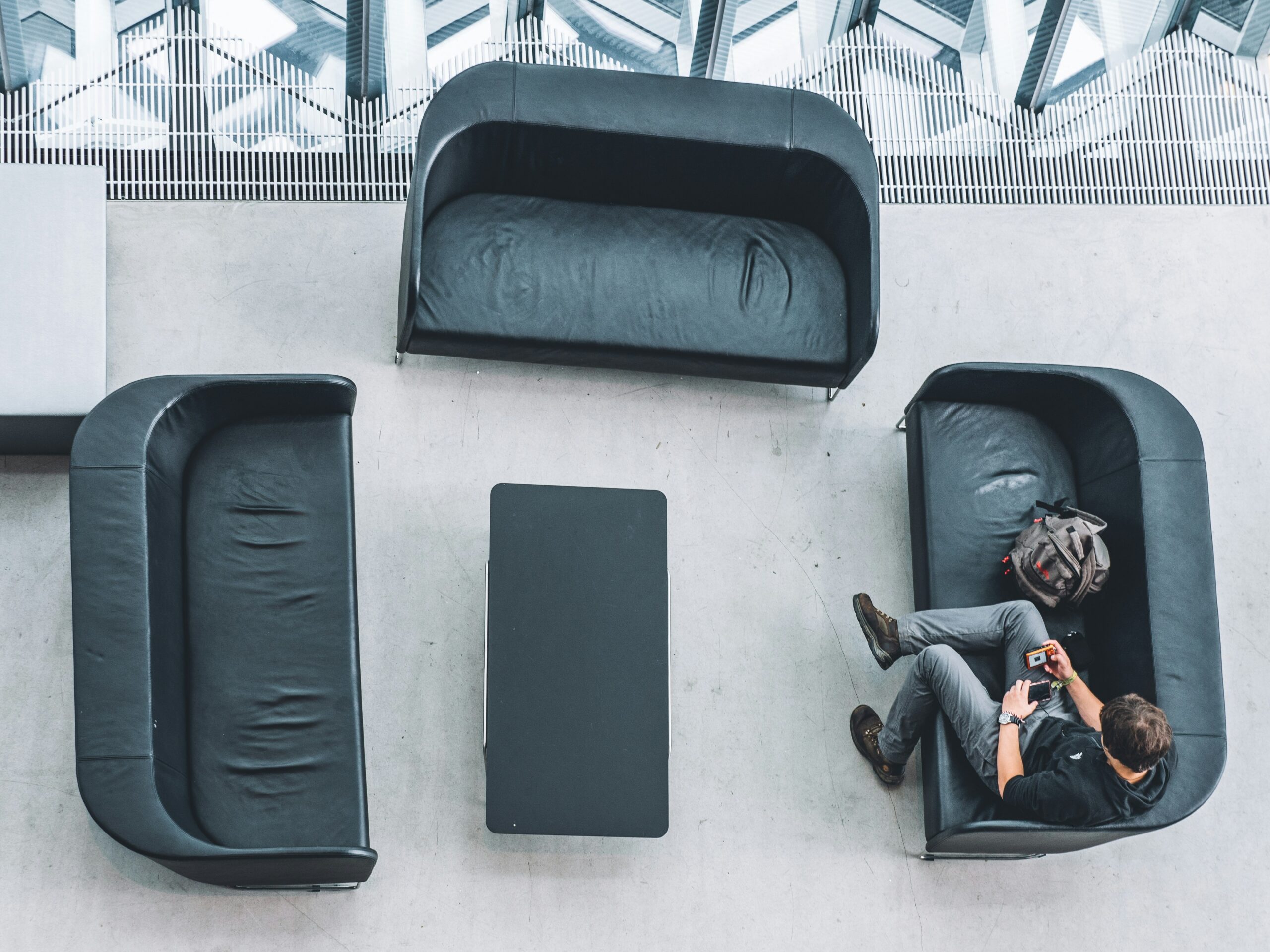 An overpacked suitcase bursting open on a bed