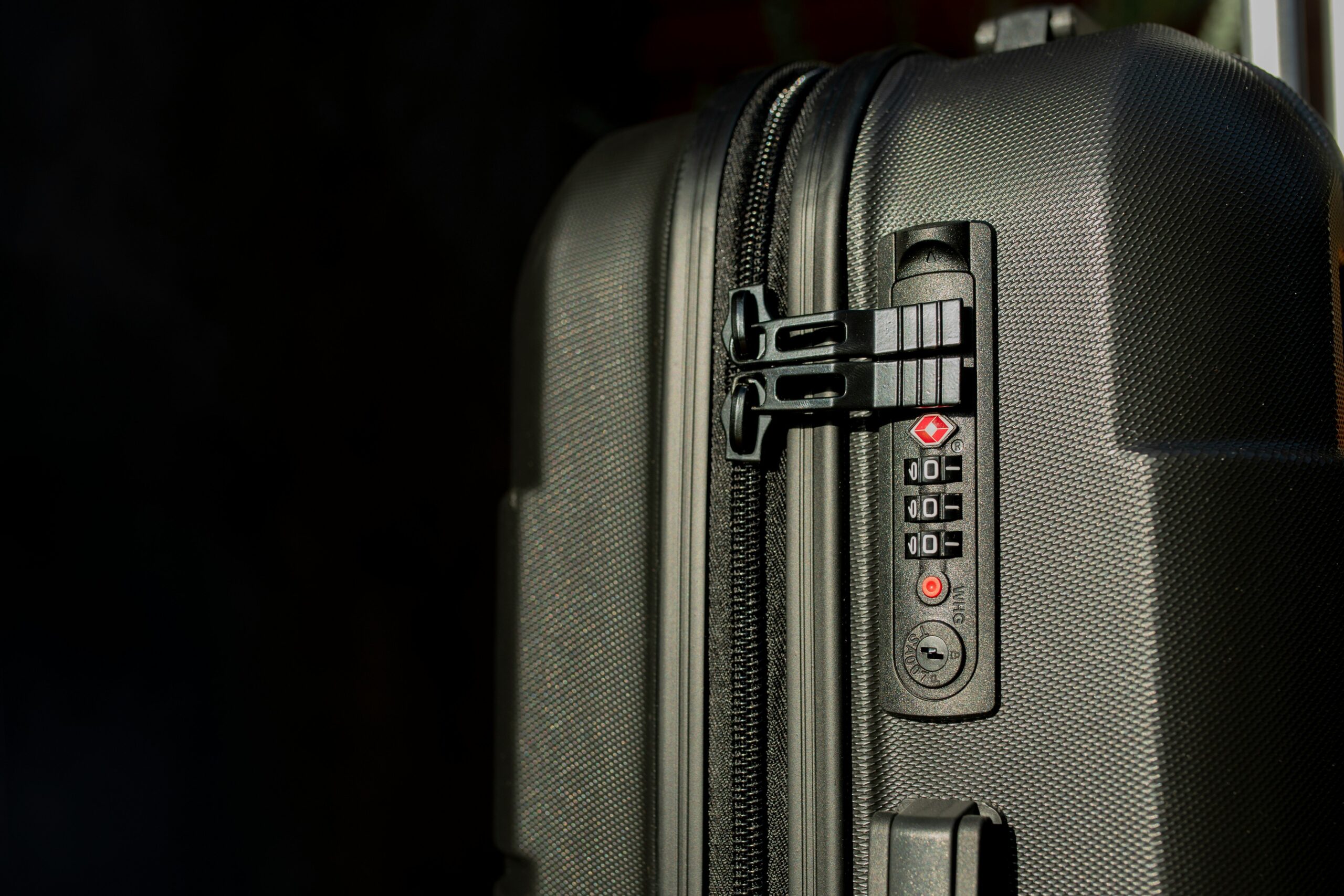 Influencer filming herself using a suitcase with built-in tripod mount