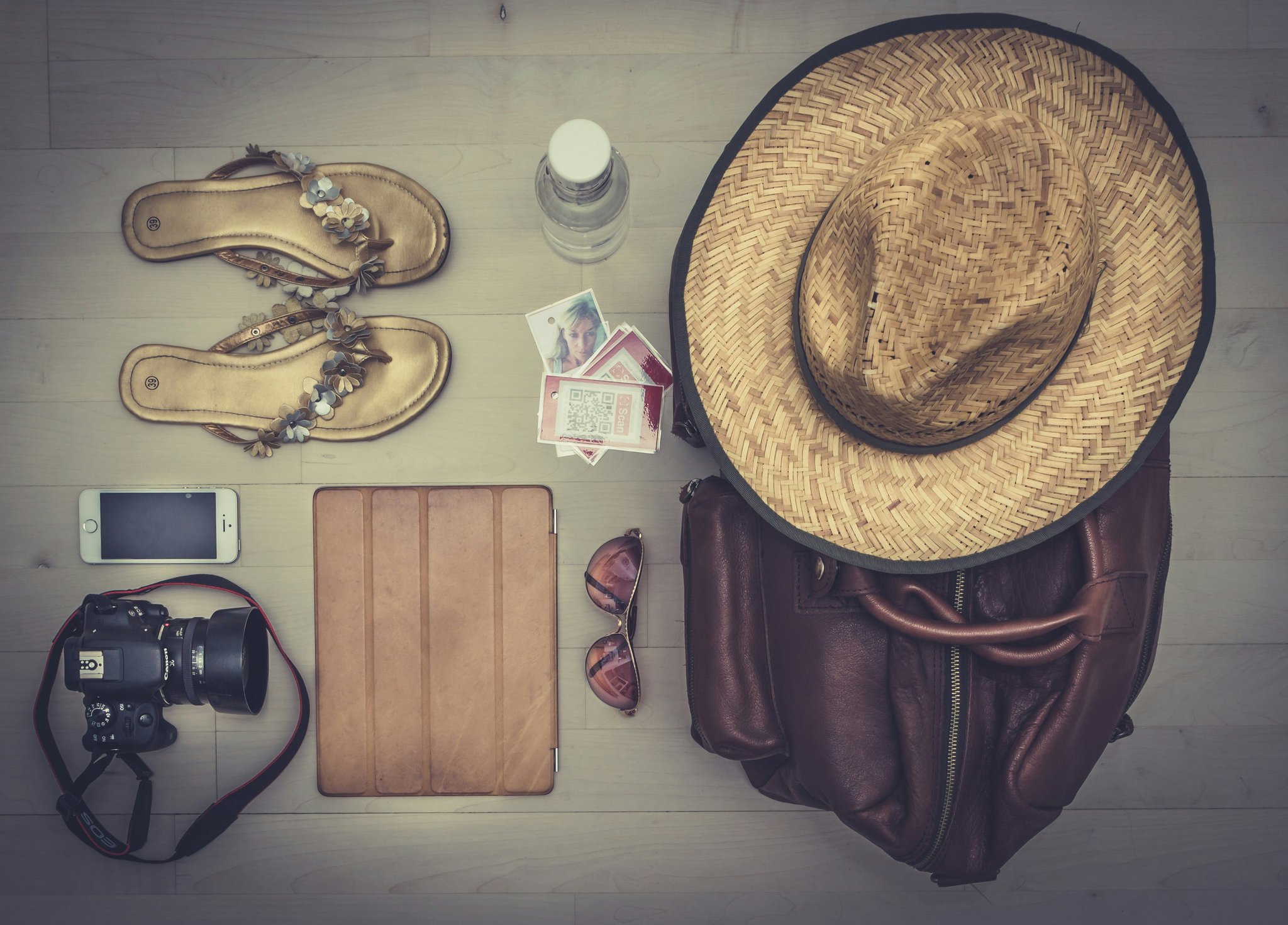 A chaotic overpacked suitcase spilling open