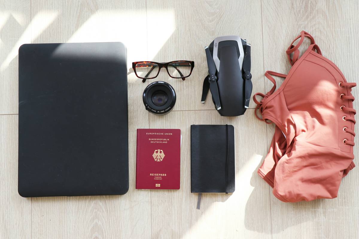 Influencer showing off a neatly packed tech-heavy backpack