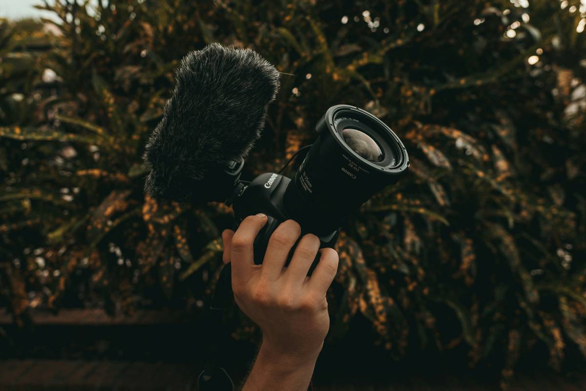 Popular travel vlogger showcasing her compact microphone setup indoors and outdoors