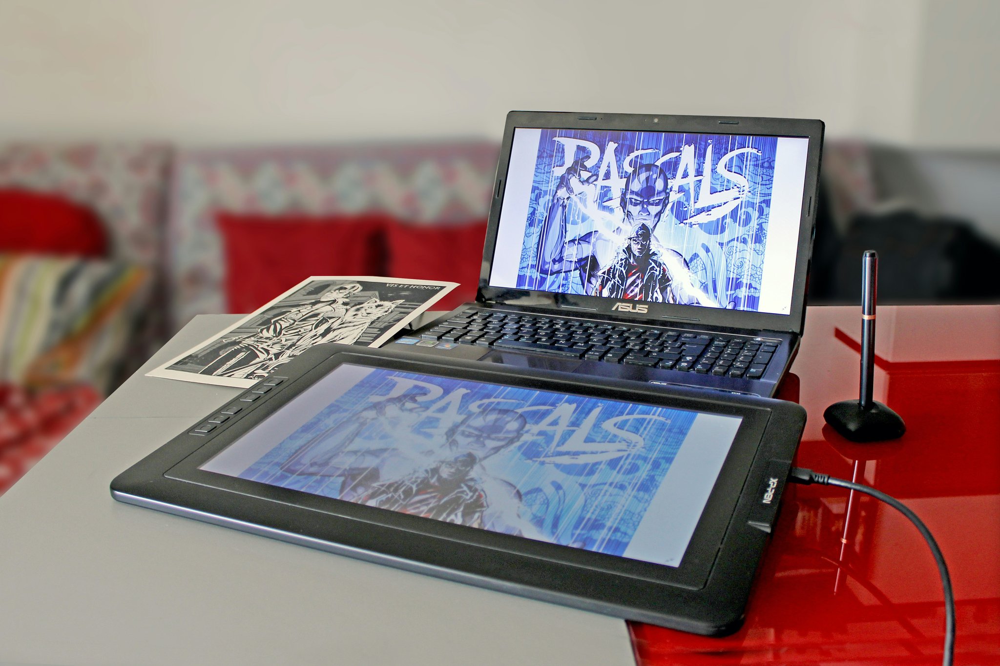 A neatly arranged travel kit showing a compact camera, foldable tripod, microphone, and USB hub