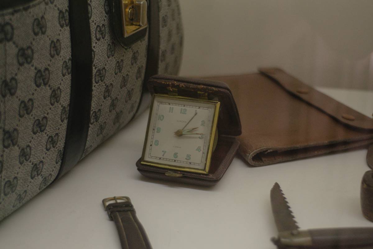 Close-up shot of a brass lock detail on vintage-style luggage