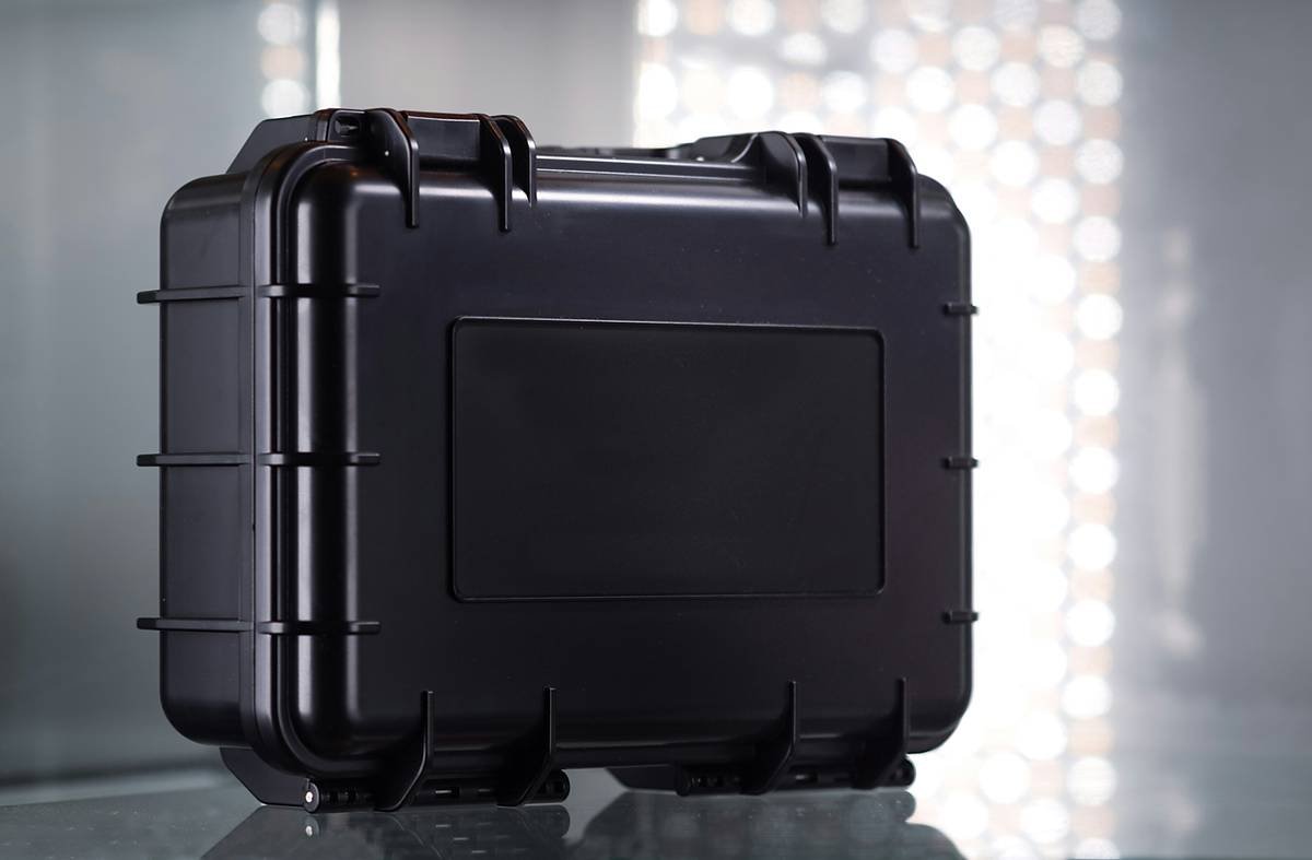 A camera cube neatly fits inside standard luggage, organizing lenses, cameras, and small accessories for safe travel.