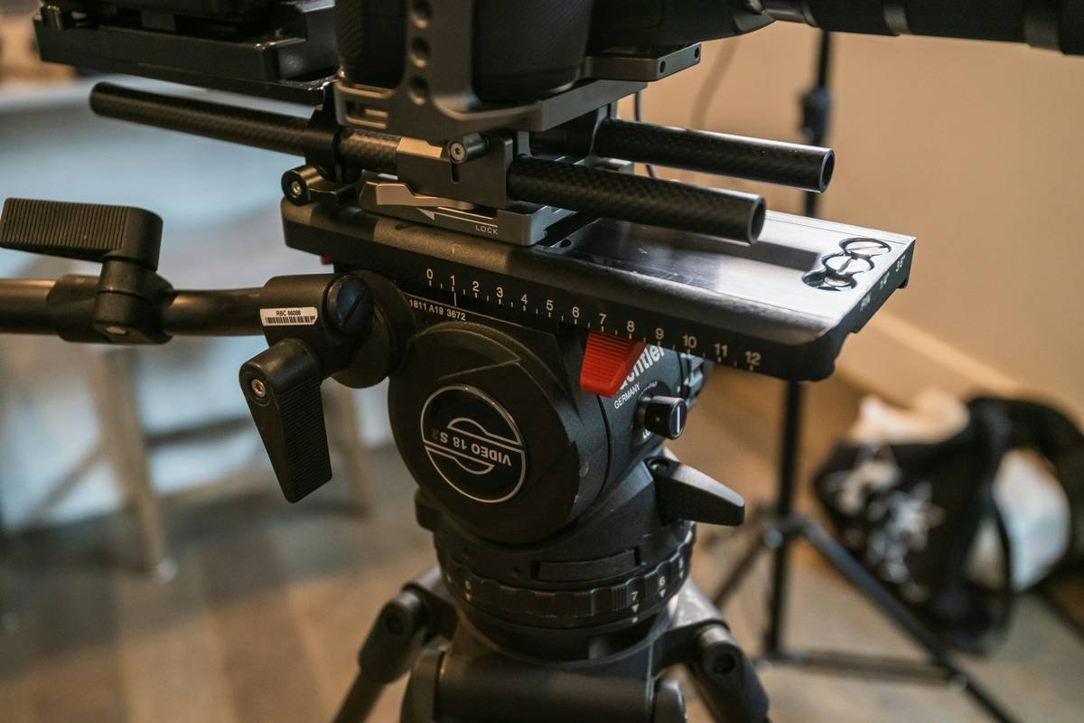 A lightweight travel tripod fluid head setup overlooking a Balinese rice field.